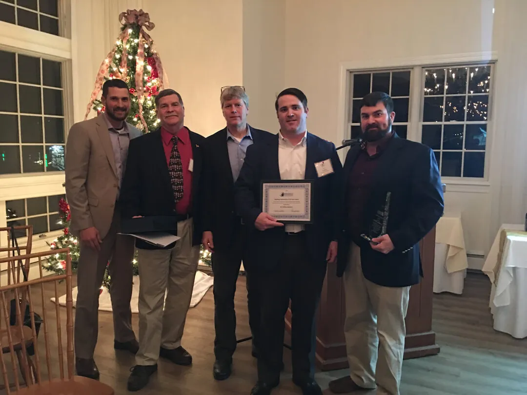 m duffany builders accepts the 2018 community building award at cape cod builders annual meeting